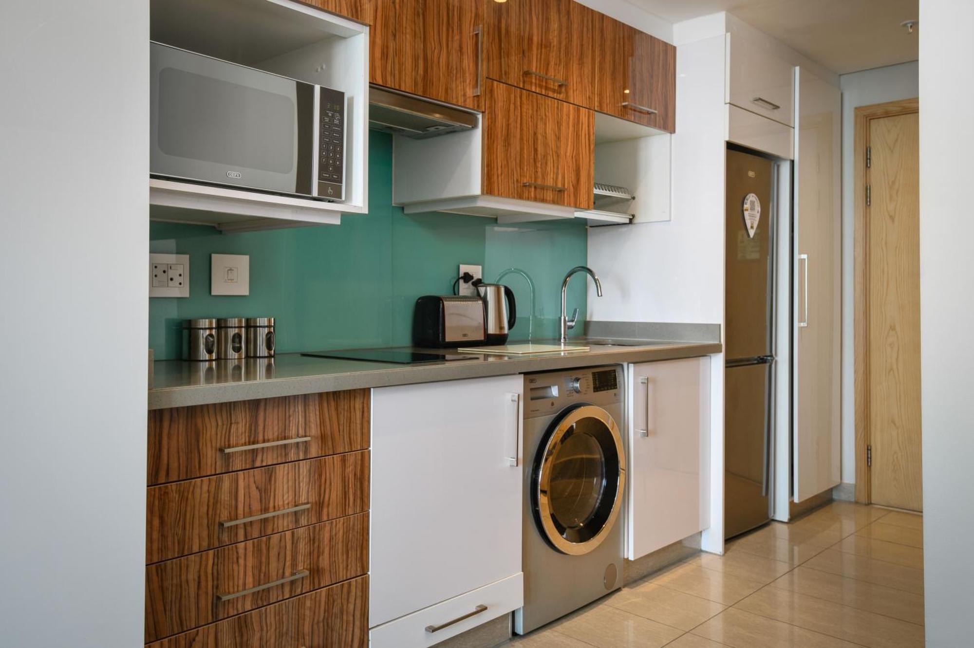 דורבן The Capital Pearls Hotel מראה חיצוני תמונה A typical kitchen in a serviced apartment